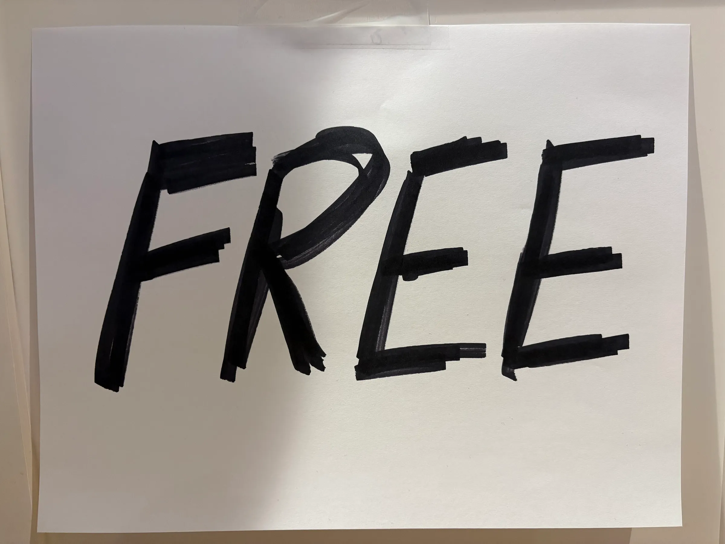 A hastily marker-drawn sign on paper saying &ldquo;FREE&rdquo;